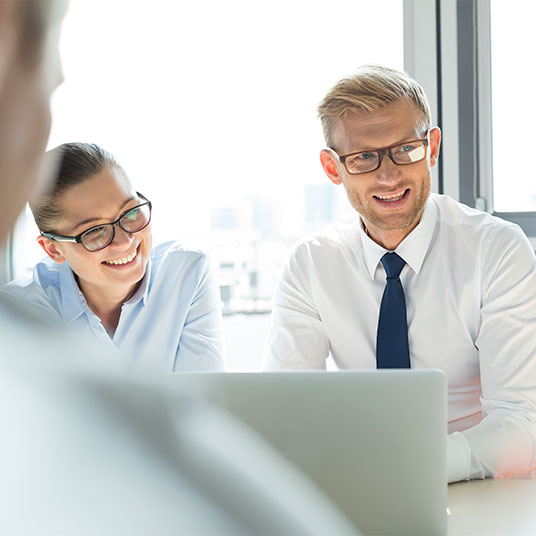 Two people in a meeting.