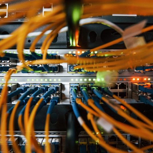 Close up view of internet equipment and cables in the server room.